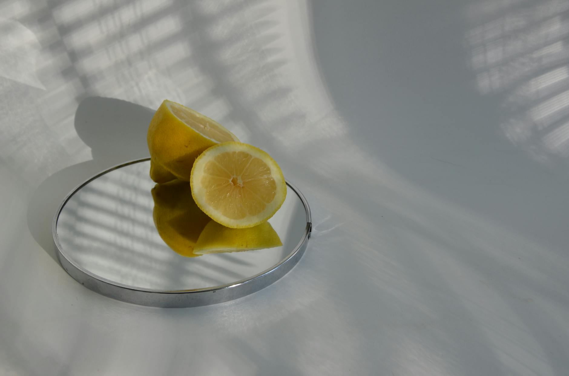 A blue silicone lemon vibrator held in hand against a solid purple background, symbolizing self-care and reclaiming pleasure