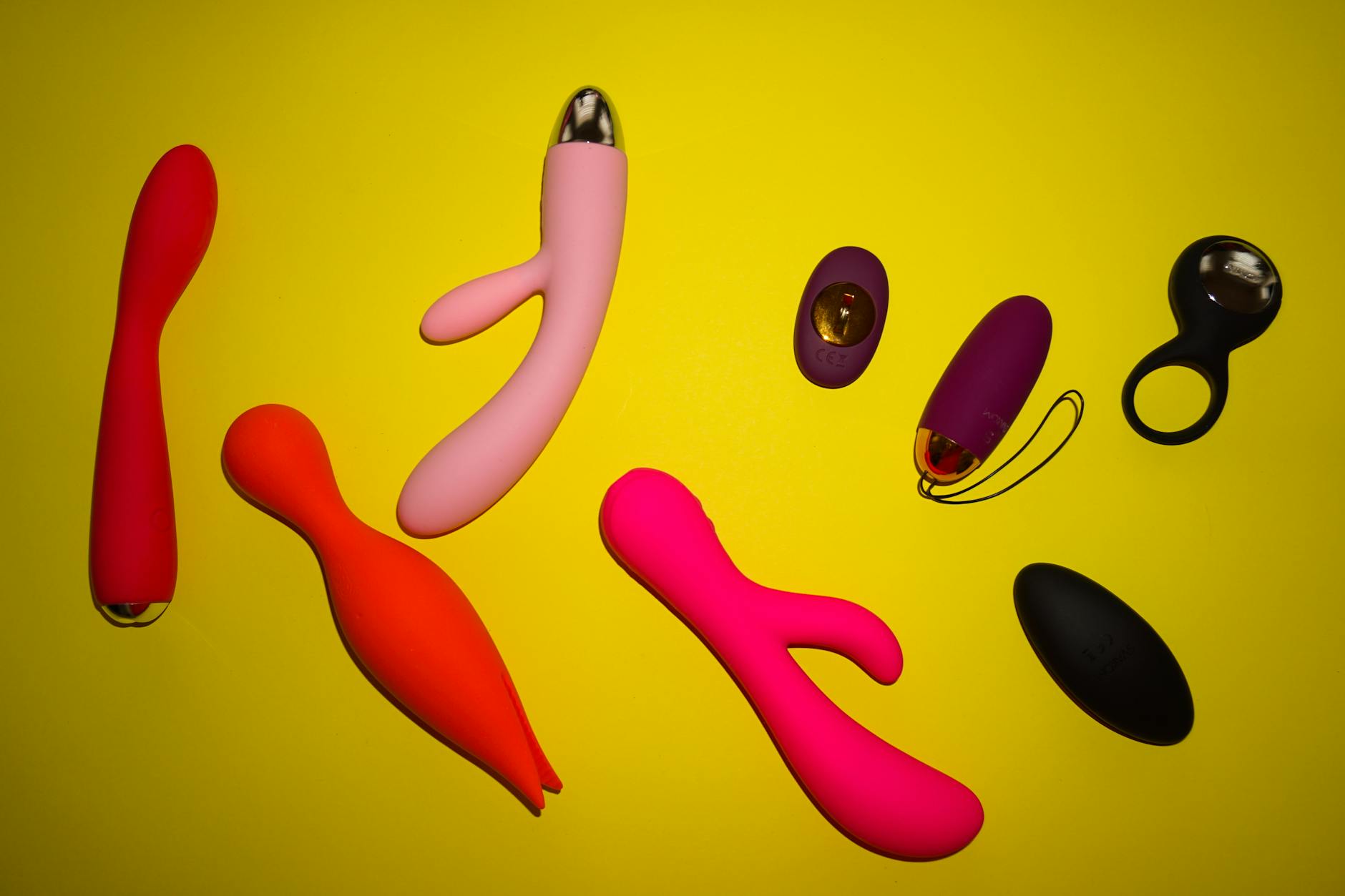 Close-up of hands holding a sleek vibrator, representing reconnection and intimate touch